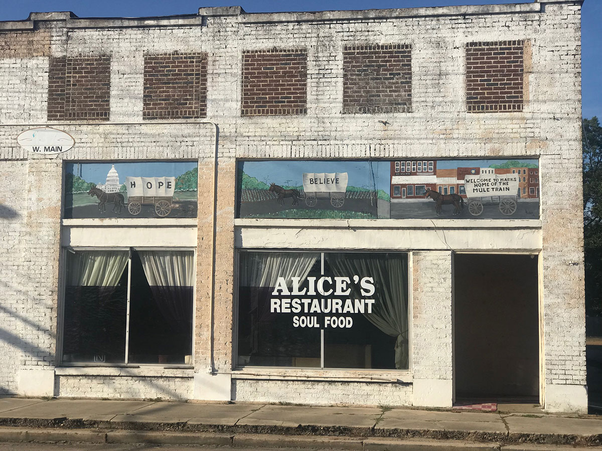 Exterior of Alice's Restaurant with Mule Train mural, Main Street, Marks, Mississippi.